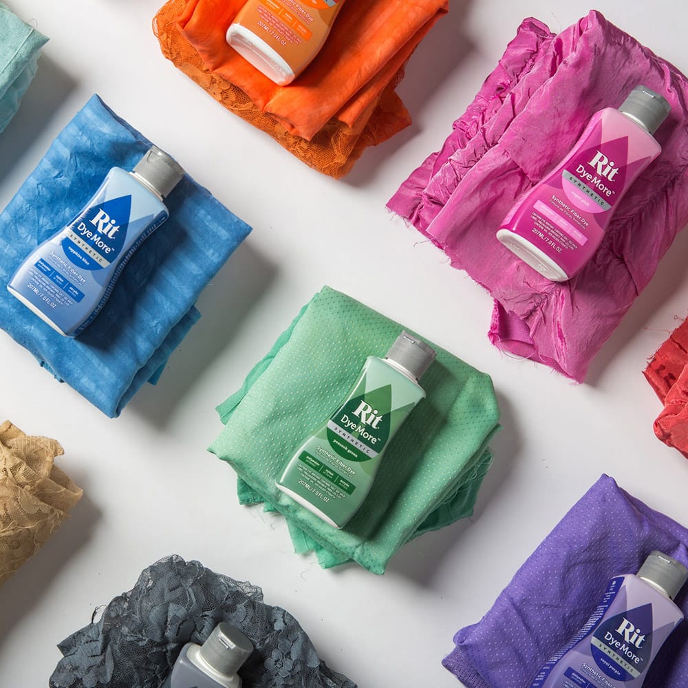 Various colors of Rit DyeMore textile dye with dyed fabrics